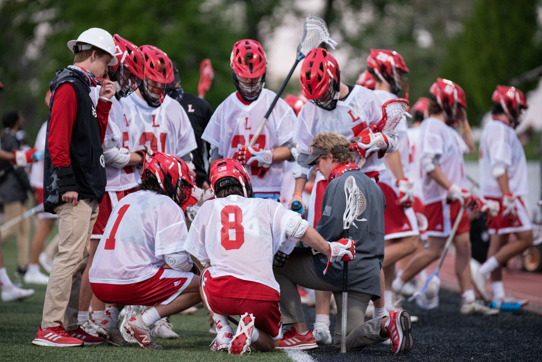 Team huddled on the sideline during a game