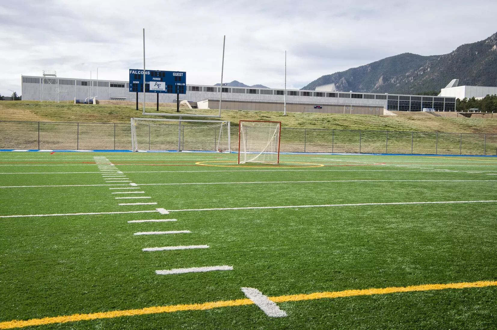 Outdoor lacrosse field at the U.S. Air Force Academy with the Rocky Mountains in the background